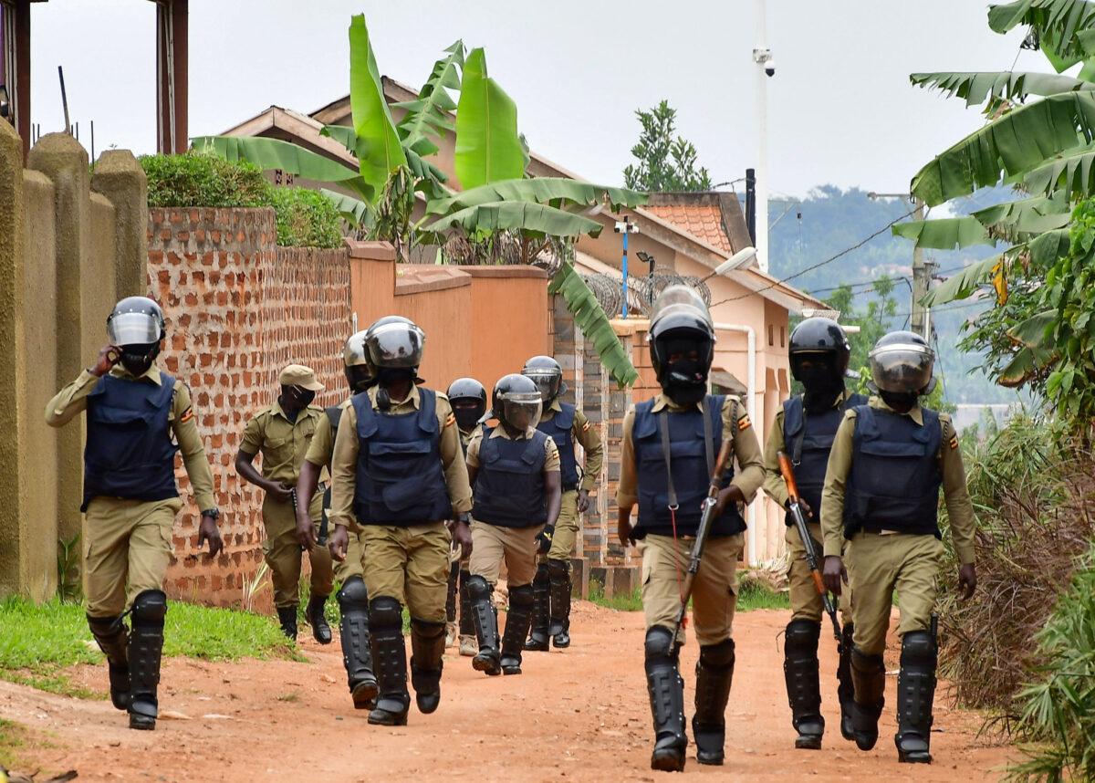 Ugandan policemen patrol an area near the house of the presidential candidate and singer Bobi Wine in Magere neighborhood of Kampala, Uganda, on Jan.16, 2021. (Abubaker Lubowa/Reuters)