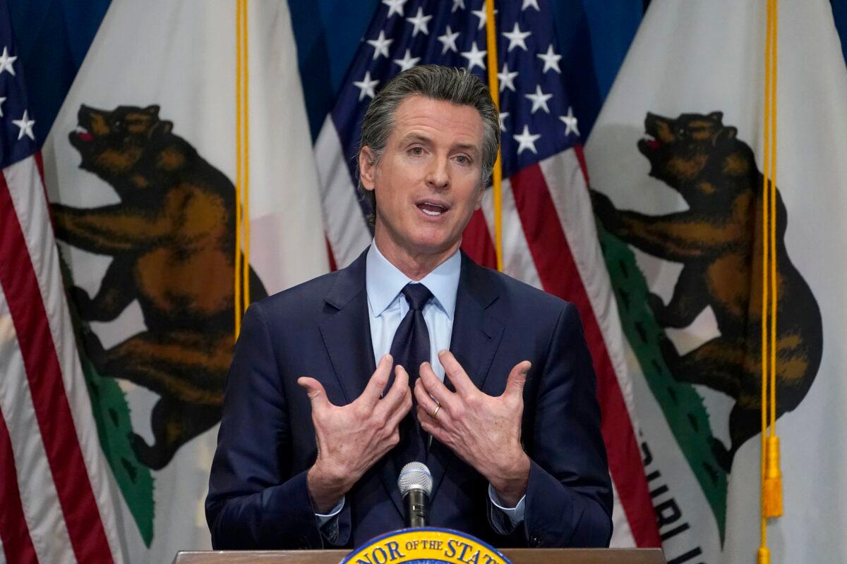 California Gov. Gavin Newsom outlines his 2021-2022 state budget proposal during a news conference in Sacramento, Calif., on Jan. 8, 2021. (Rich Pedroncelli/Pool/AP Photo)