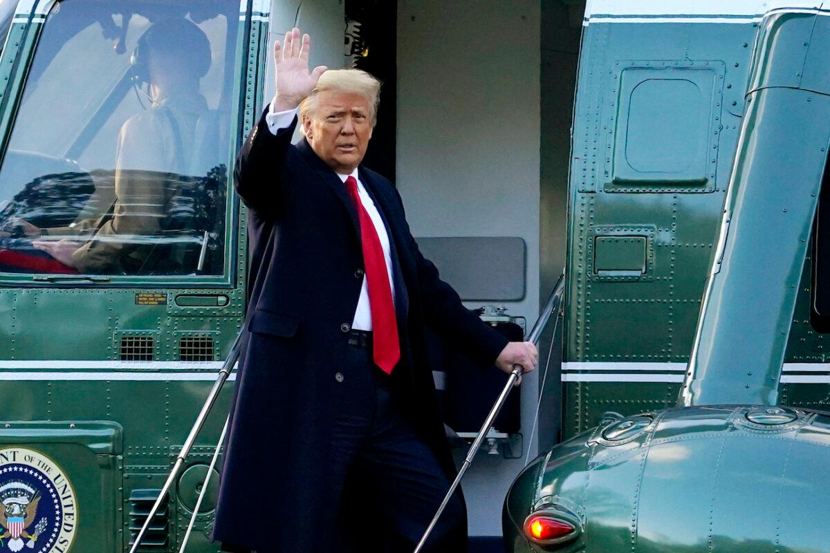 President Donald Trump waves as he boards Marine One on the South Lawn of the White House in Washington on Jan. 20, 2021. (Alex Brandon/AP Photo)