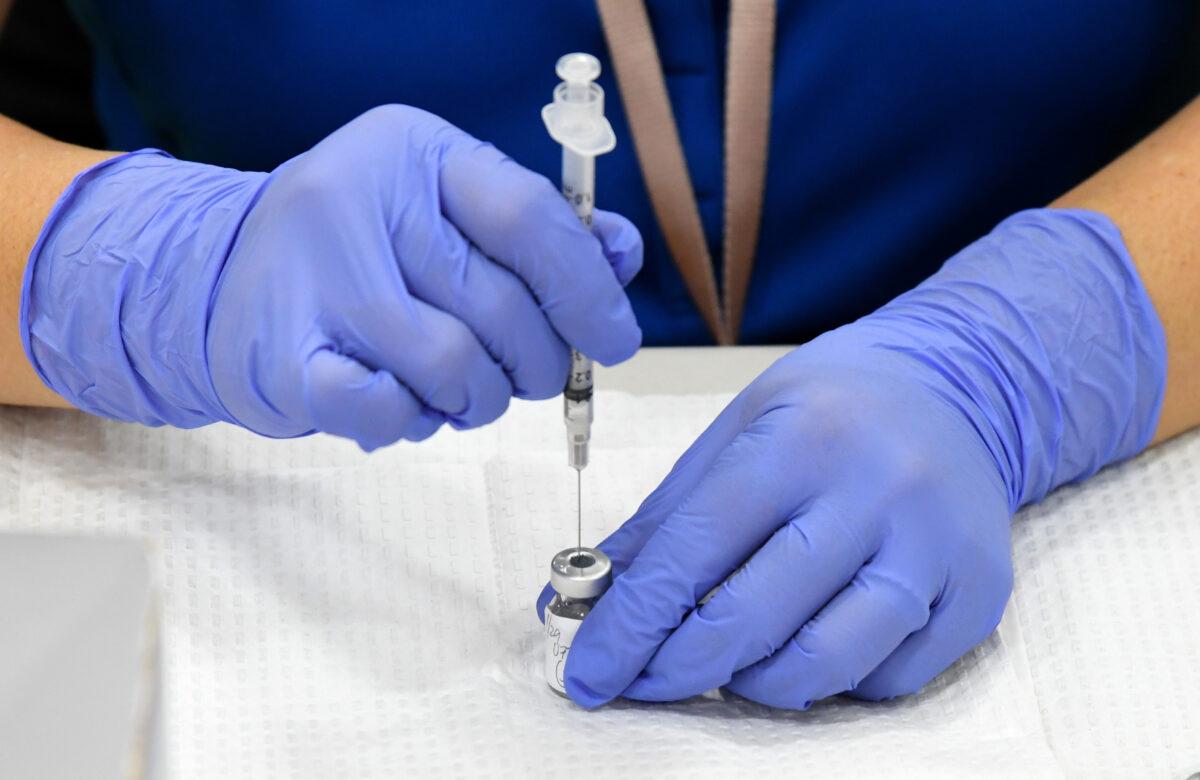 A nurse prepares a Pfizer COVID-19 vaccine for administration at Jerome Mack Middle School in Las Vegas, on Jan. 29, 2021. (Ethan Miller/Getty Images)