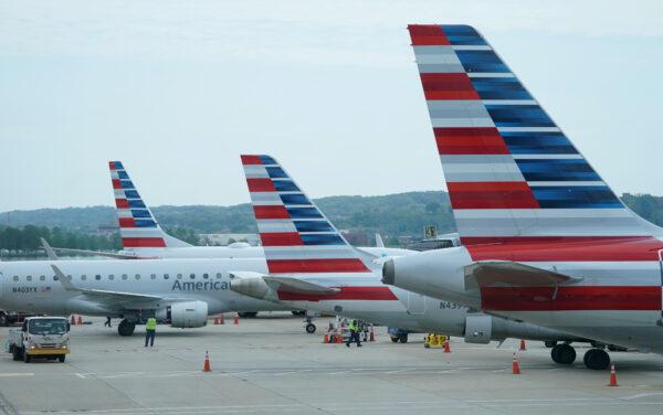 American Airlines jets made by Embraer and other manufacturers sit at gates at Washington's Reagan National Airport amid the coronavirus pandemic, in Washington on April 29, 2020. (Kevin Lamarque/Reuters)