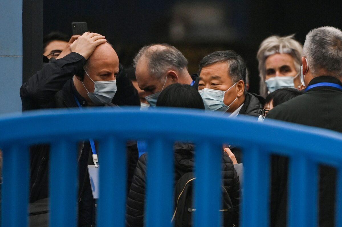 Members of the World Health Organization team investigating the origins of the COVID-19 visit the closed Huanan Seafood wholesale market in Wuhan, Hubei Province, China, on Jan. 31, 2021. (Hector Retamal/AFP via Getty Images)