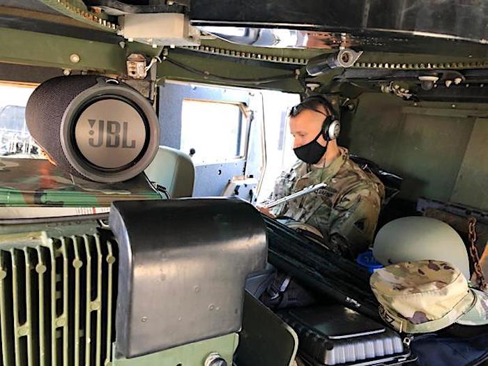 Sgt. Kohut in the back of a Humvee (Courtesy of <a href="http://jacobkohutmusic.com/">Jacob Kohut</a>)