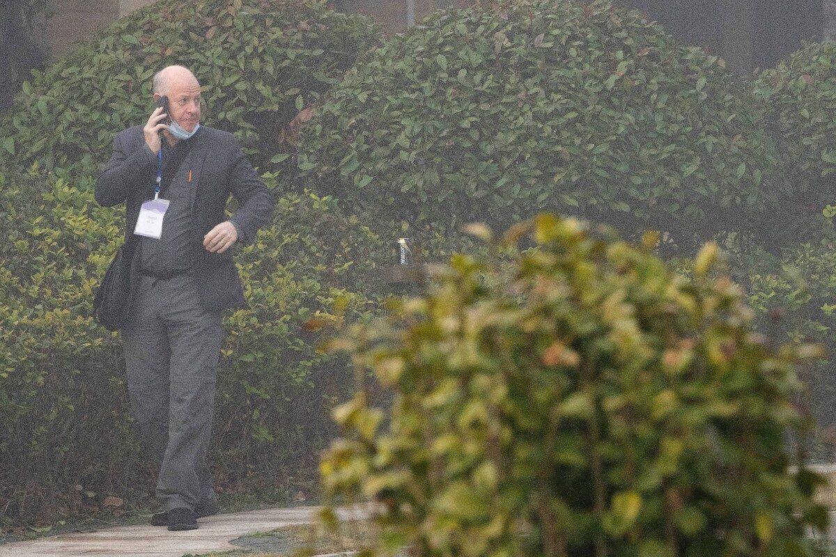 Peter Daszak makes a call on a foggy day before leaving his hotel with other members of a World Health Organization team for another day of field visit in Wuhan in central China's Hubei province, China, on Feb. 3, 2021. (Ng Han Guan/AP Photo)
