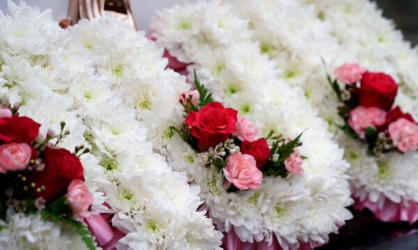 Flowers at a funeral at T Cribb & Sons funeral home in London on Jan. 31, 2021. (NTD/Screenshot)