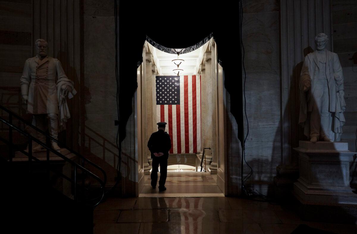 A U.S. Capitol Police officer stands at the door of the Capitol Rotunda near where the late U.S. Capitol Police officer Brian Sicknick will lie in honor in Washington, Feb. 2, 2021. (Salwan Georges/The Washington Post via AP, Pool)