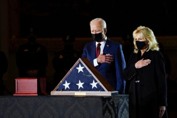 President Joe Biden and First Lady Jill Biden, and members of the Capitol Police, pay their respects to the late Capitol Police officer Brian Sicknick who lies in honor in the Rotunda of the Capitol in Washington, on Feb. 2, 2021. (Erin Schaff/The New York Times via AP, Pool)