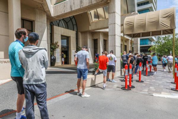 People associated with the Australian Open are seen lining up at a testing facility at the View Melbourne Hotel on February 04, 2021 in Melbourne, Australia. (Asanka Ratnayake/Getty Images)