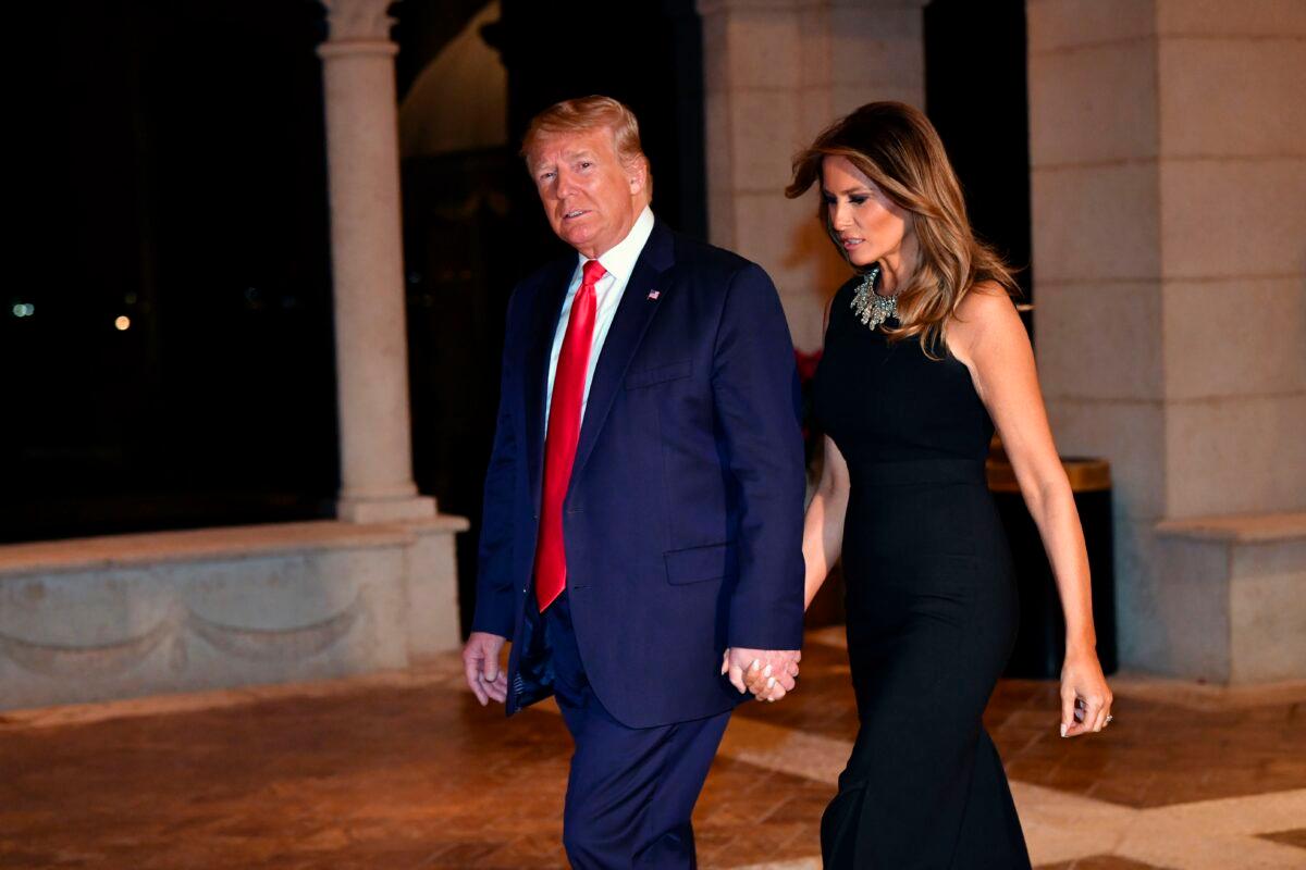 Former President Donald Trump and First Lady Melania Trump arrive for a Christmas Eve dinner with their family at Mar-a-Lago in Palm Beach, Fla., on Dec. 24, 2019. (Nicholas Kamm/AFP via Getty Images)