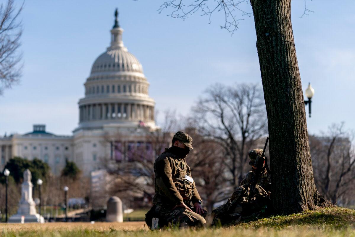 Members of the National Guard work outside the U.S Capitol building on Capitol Hill, in Washington, on Jan. 20, 2021. (AP Photo/Andrew Harnik)