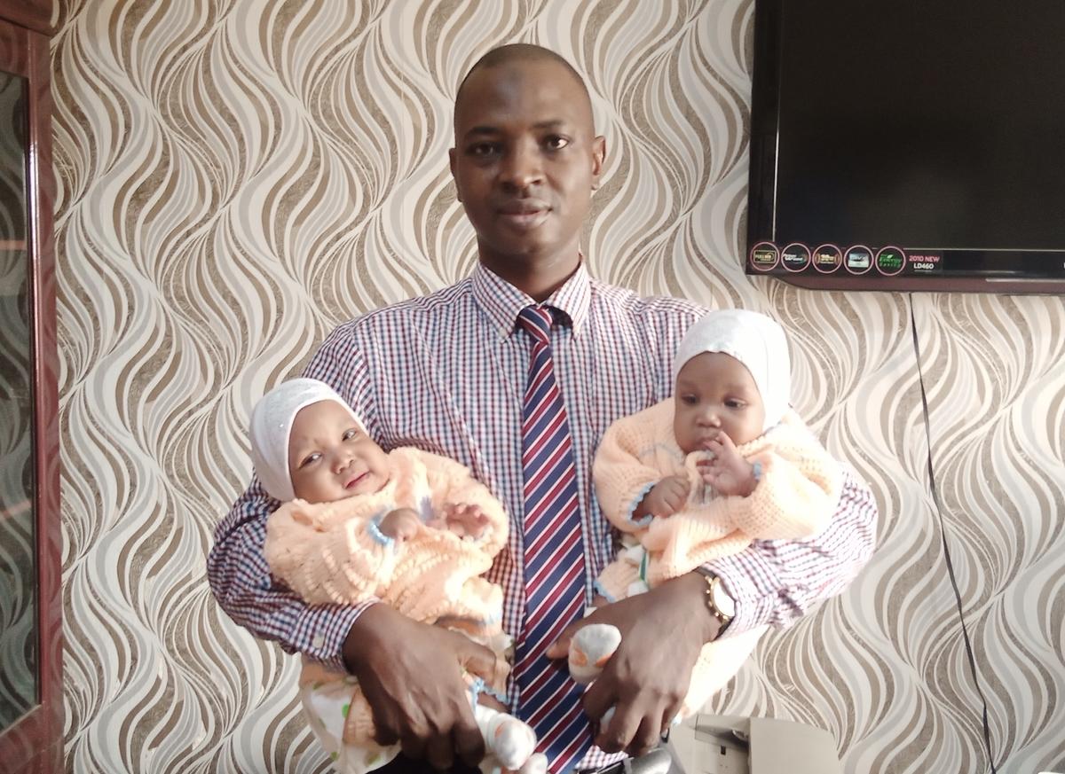 Professor Lukman Abdur-Rahman with the twins, successfully separated (Courtesy of Lukman Abdur-Rahman)