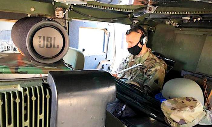 Music Teacher in National Guard Teaches Music Class From Humvee in Washington