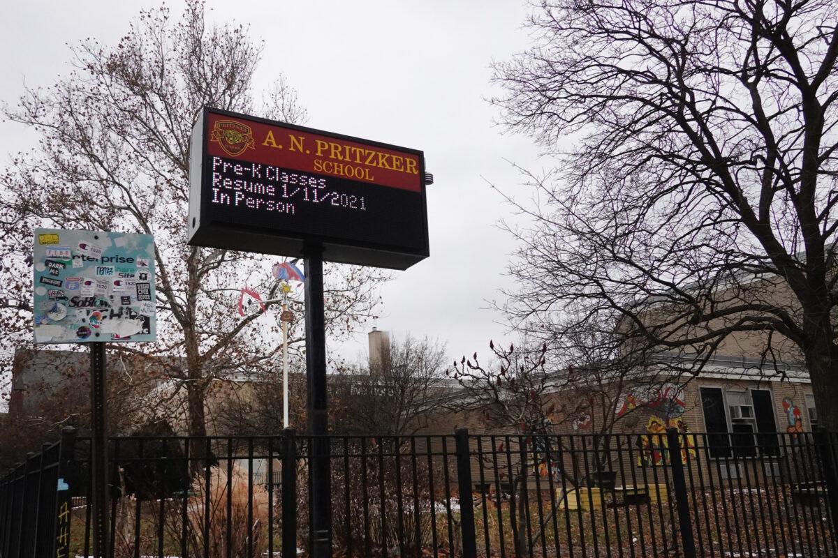 A sign outside of Pritzker Elementary School delivers messages to students and parents in Chicago, Ill., on Jan. 25, 2021. Chicago Public School teachers were scheduled to return to the classroom for in-person learning but the union objected and voted to continue remote learning. (Scott Olson/Getty Images)