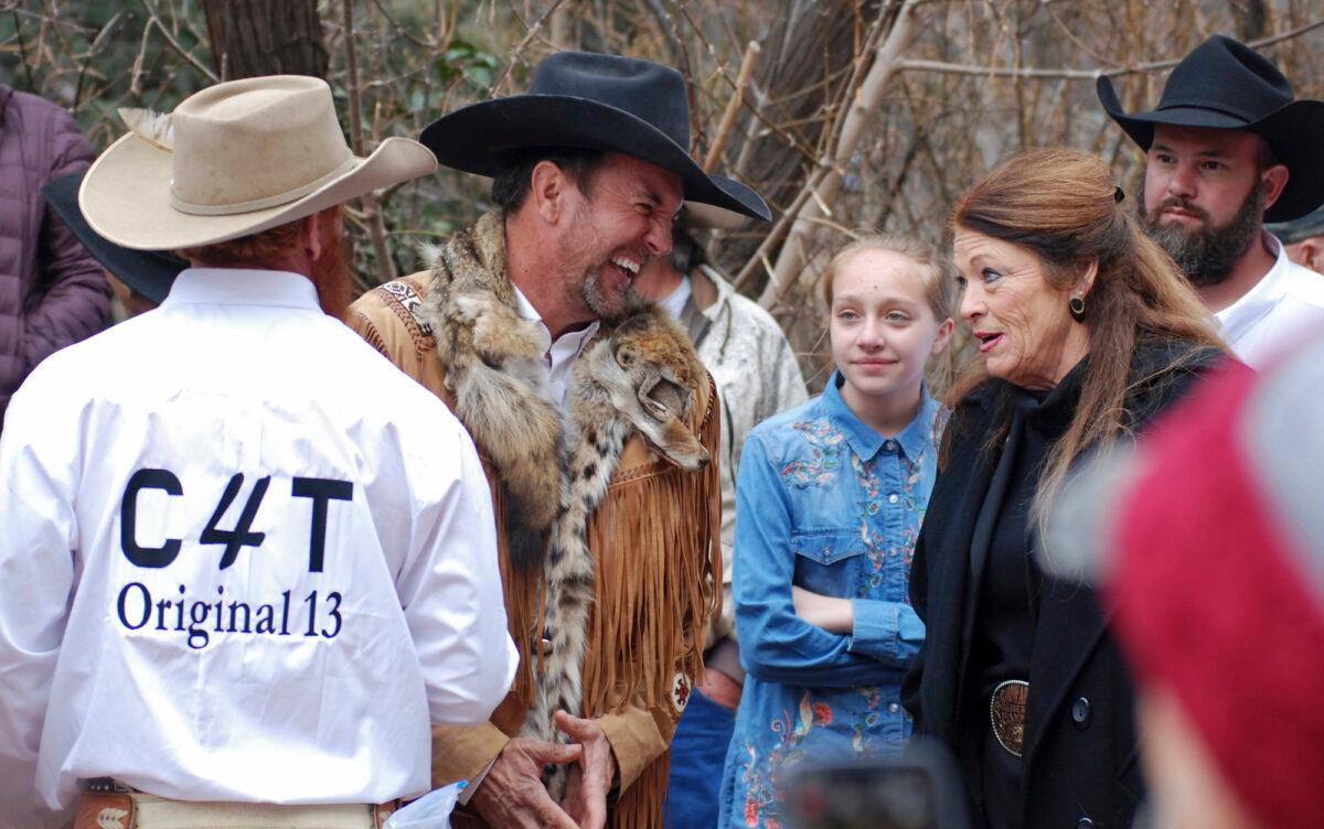 Cowboys for Trump founder Couy Griffin, center, talks with Republican New Mexico state Rep. Candy Ezzell, at a protest against gun control and pro-abortion rights legislation outside the New Mexico State Capitol, in Santa Fe, N.M., on March 12, 2019. (Morgan Lee/AP Photo, File)