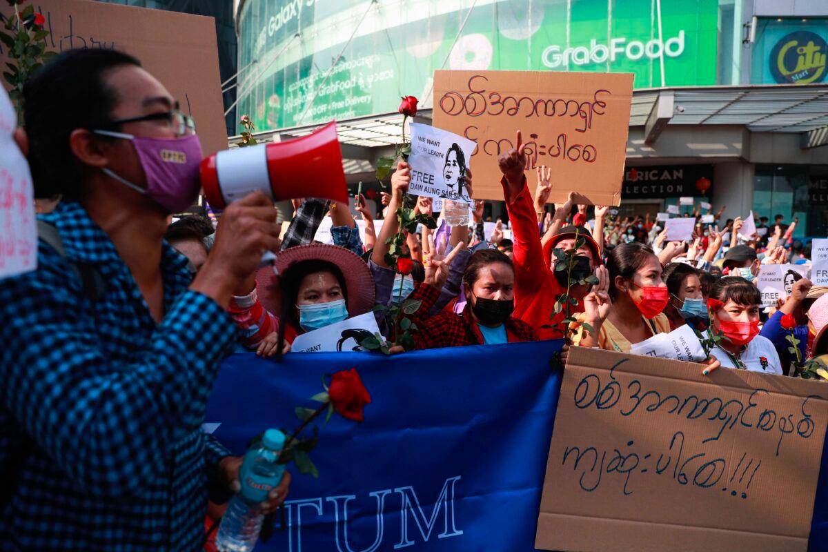 Protesters gather outside the Hledan Center in Yangon, Burma, on Feb. 7, 2021. (AP Photo)