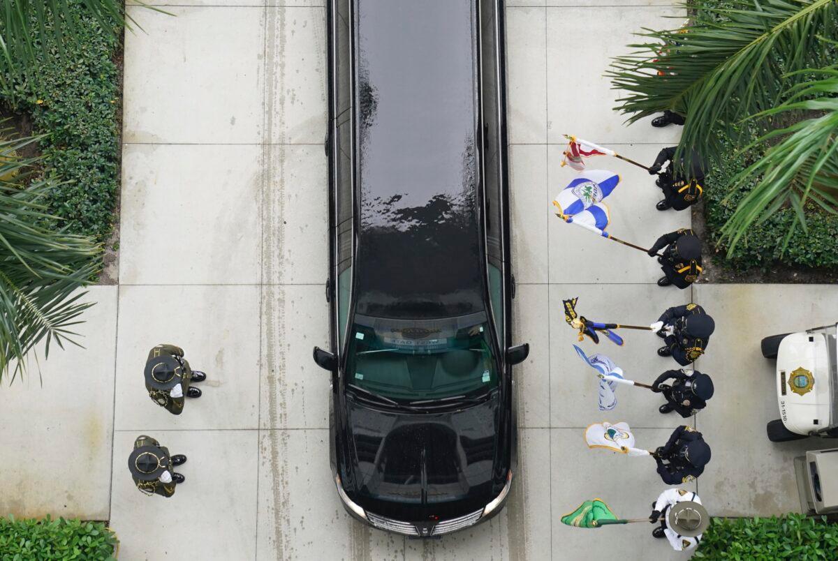Family members arrive in the procession behind the hearse carrying the casket of FBI Special Agent Laura Schwartzenberger as they arrive at the memorial service in Miami Gardens, Fla., on Feb. 6, 2021. (Hans Deryk/AP Photo)
