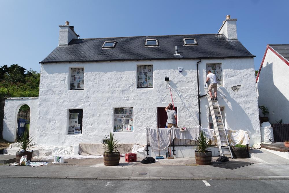 Painting the exterior of a house is a big job that requires extensive use of tall ladders. (Faye kao/Shutterstock)