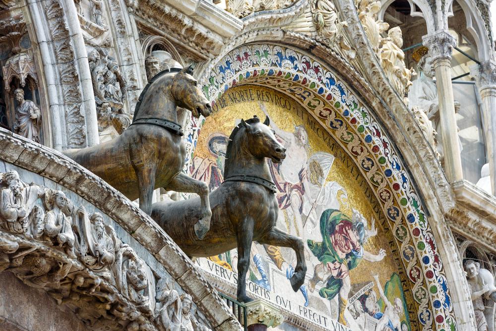 The bronze horses are replicas of the ancient horses that once stood in their place. The original copper-gilded horses from the Hippodrome in Istanbul are now protected inside the basilica. (Viacheslav Lopatin/Shutterstock.com)