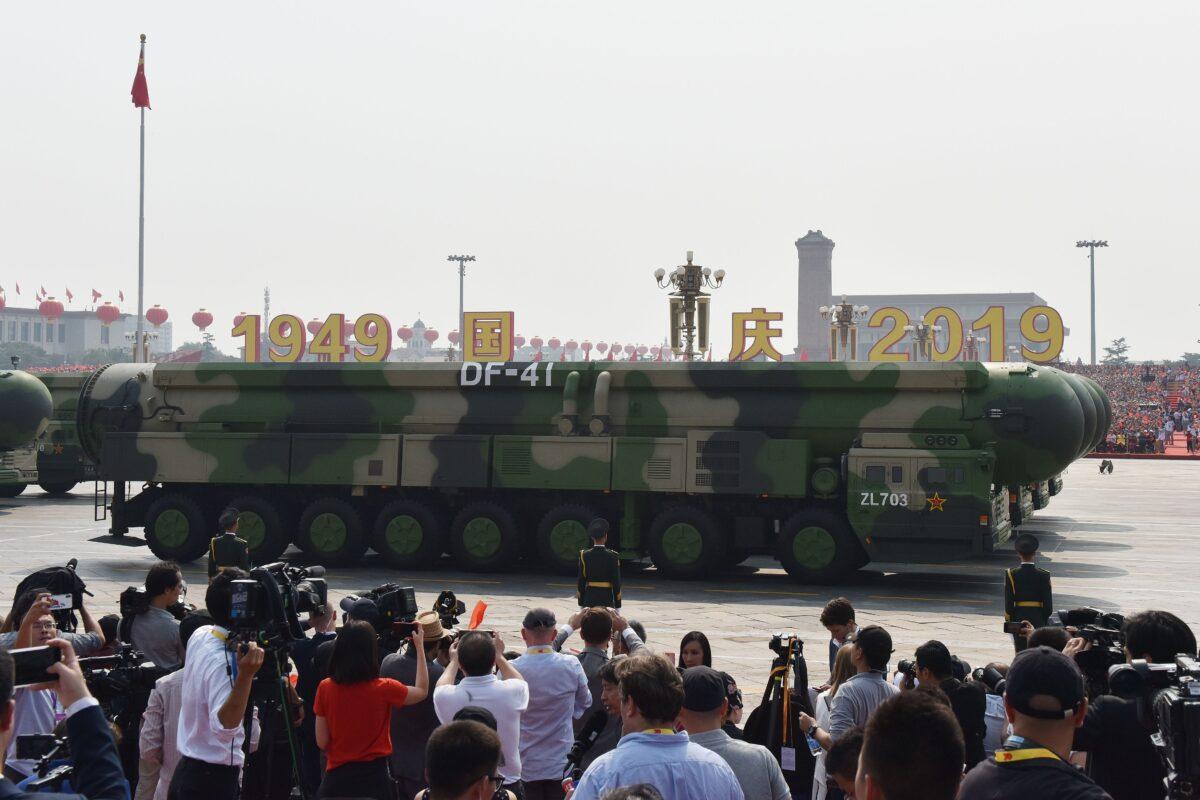 Military vehicles carry China's DF-41 nuclear-capable intercontinental ballistic missiles in a military parade at Tiananmen Square in Beijing, China, on Oct. 1, 2019. (Greg Baker/AFP via Getty Images)