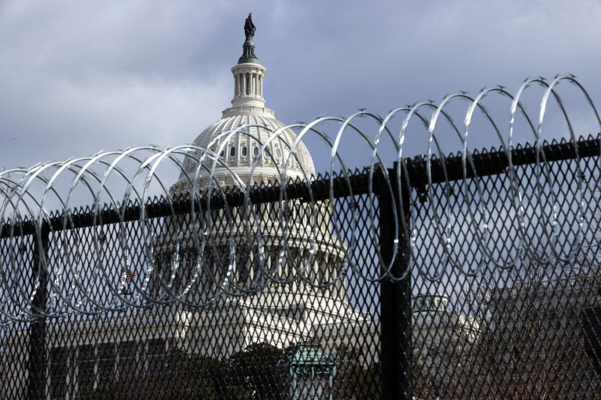 An eight-foot tall steel fence topped with concertina razor wire circles the U.S. Capitol January 29, 2021 in Washington. (Chip Somodevilla/Getty Images)
