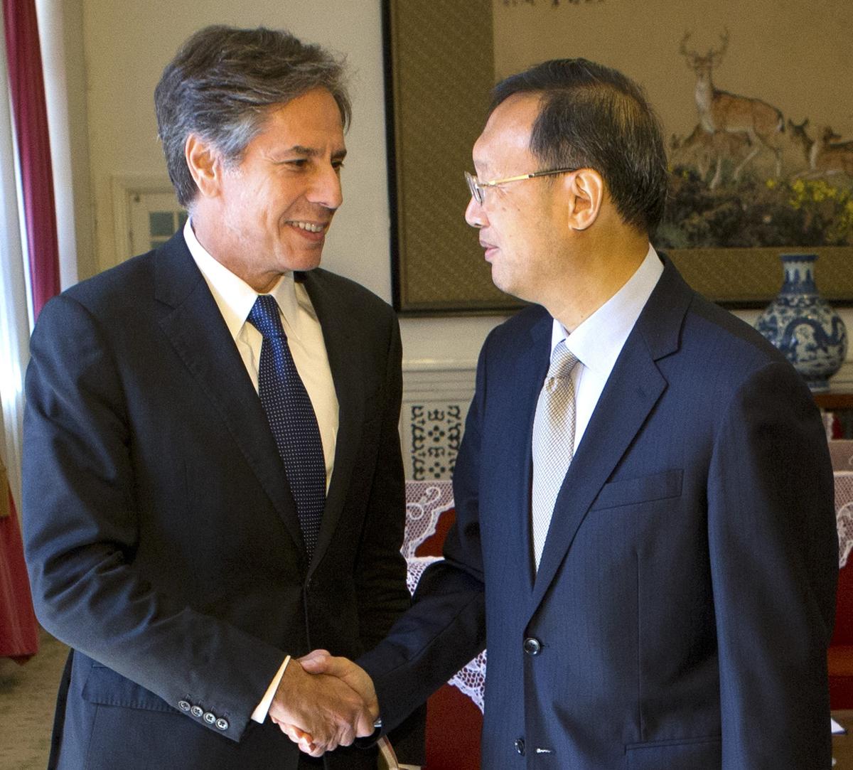 U.S. Deputy Secretary of State Antony Blinken shakes hands with Chinese State Councilor Yang Jiechi as Blinken arrives for a meeting at the Zhongnanhai Leadership Compound in Beijing, China, on Oct. 8, 2015. (Mark Schiefelbein/AFP via Getty Images)