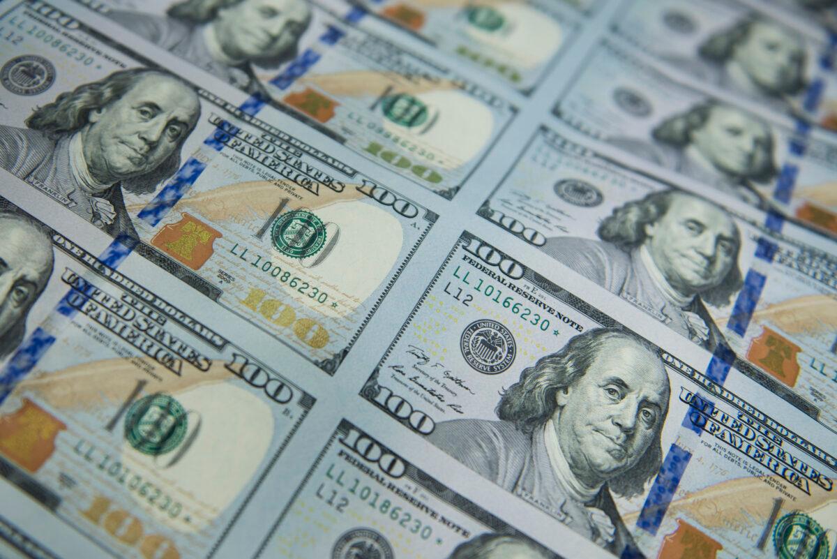 New 100 USD bills are applied with a serial number, a U.S. Federal Reserve seal, cut and stacked at the U.S. Bureau of Engraving and Printing's Western Currency Facility in Fort Worth, Texas, on Oct. 11, 2013. (Brendan Smialowski/AFP via Getty Images)