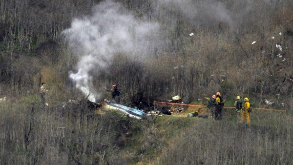 Firefighters work the scene of a helicopter crash in Calabasas, Calif., on Jan. 26, 2020. (Mark J. Terrill/AP Photo)
