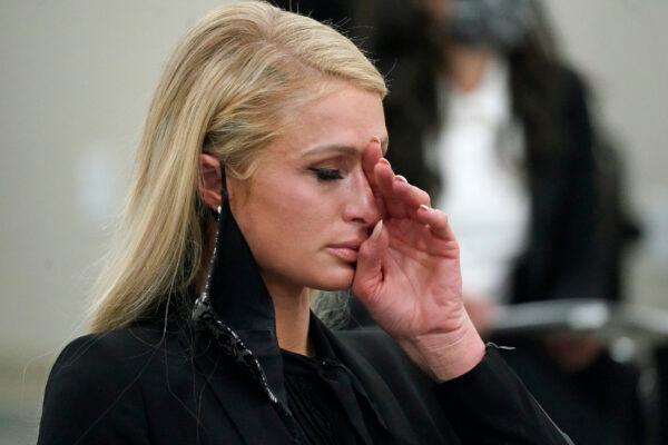 Paris Hilton wipes her eyes after speaking at a committee hearing at the Utah State Capitol in Salt Lake City on Feb. 8, 2021. (Rick Bowmer/AP Photo)