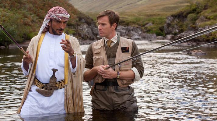 Amr Waked (L) and Ewan McGregor discuss matters of faith, in “Salmon Fishing in the Yemen.” (CBS Films Inc.)