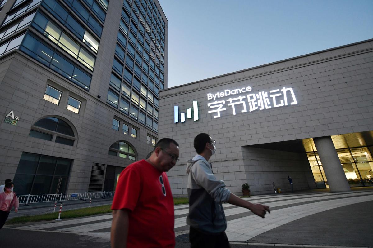 People walk past the headquarters of ByteDance, the parent company of video-sharing app TikTok, in Beijing on Sept. 16, 2020. (Greg Baker/AFP via Getty Images)