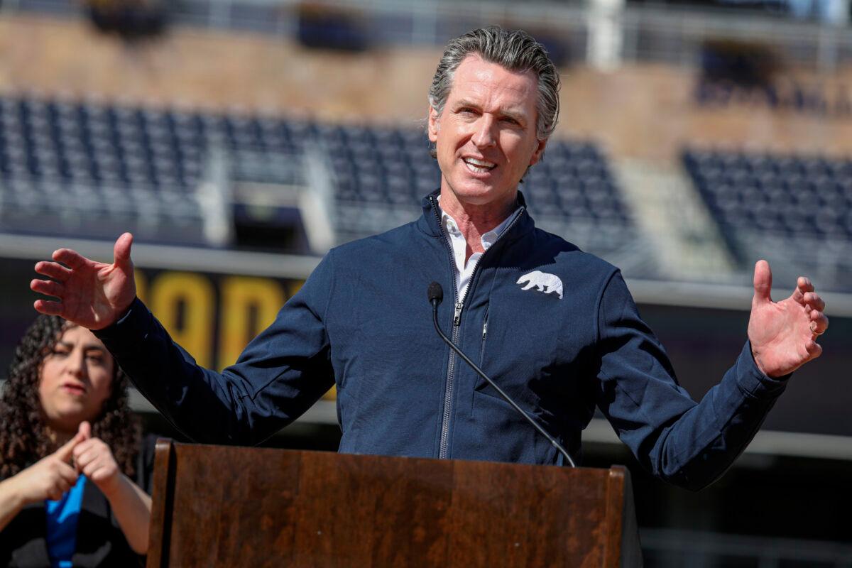 California Gov. Gavin Newsom speaks during a press conference at Petco Park in San Diego, Calif., on Feb. 8, 2021. (Sandy Huffaker/AFP via Getty Images)