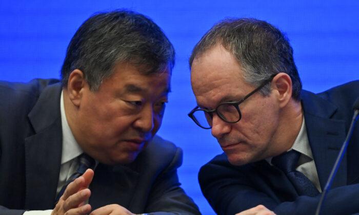 Peter Ben Embarek (R) talks with Liang Wannian (L) during a press conference in the city of Wuhan, in China's Hubei Province, on Feb. 9, 2021. (Hector Retamal/AFP via Getty Images)