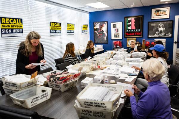 Volunteers sort recall mail to oust California Governor Gavin Newsom at Capital Campaigns Incorperated in Newport Beach, Calif., on Jan 4, 2021. (John Fredricks/The Epoch Times)