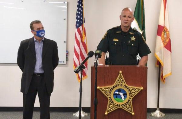 In this screen shot from a YouTube video posted by the Pinellas County Sheriff's Office, Pinellas County Sheriff Bob Gualtieri speaks during a news conference as Oldsmar, Fla., Mayor Eric Seidel, left, listens, in Oldsmar, Fla., on Feb. 8, 2021. (Pinellas County Sheriff's Office via AP)