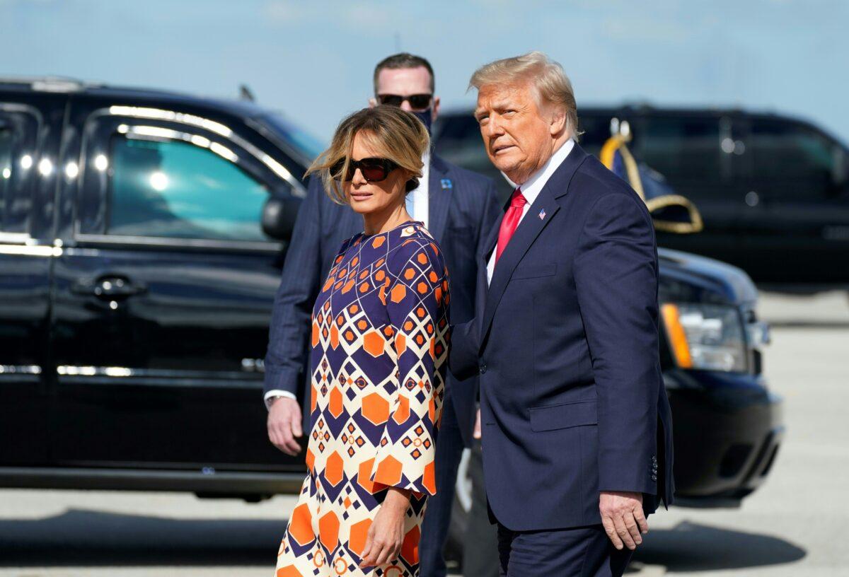 Outgoing President Donald Trump and First Lady Melania Trump arrive at Palm Beach International Airport in West Palm Beach, Fla., on Jan. 20, 2021. (Alex Edelman/AFP via Getty Images)