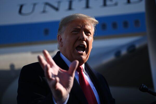 President Donald Trump speaks to the media as he makes his way to board Air Force One before departing from Andrews Air Force Base in Maryland on Jan. 12, 2021. (Mandel Ngan/AFP via Getty Images)