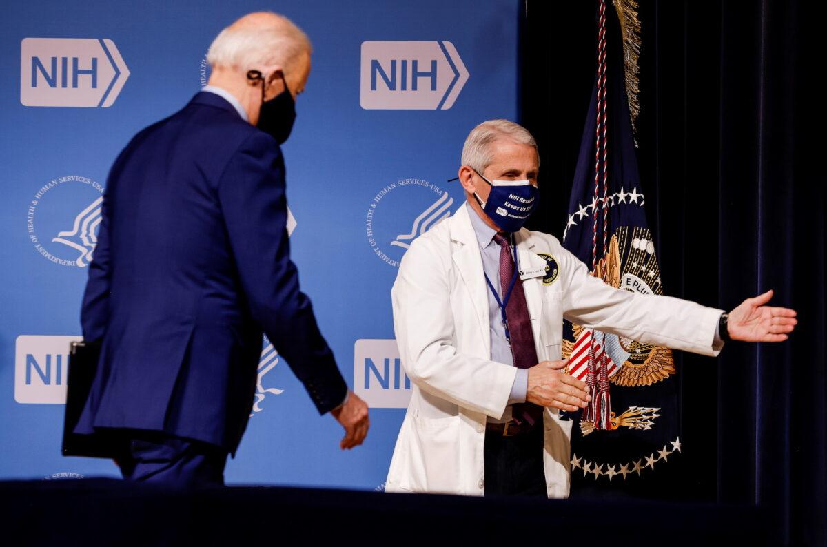 National Institute of Allergy and Infectious Diseases Director Dr. Anthony Fauci (R) beckons to President Joe Biden in Bethesda, Maryland, on Feb. 11, 2021. (Carlos Barria/Reuters)