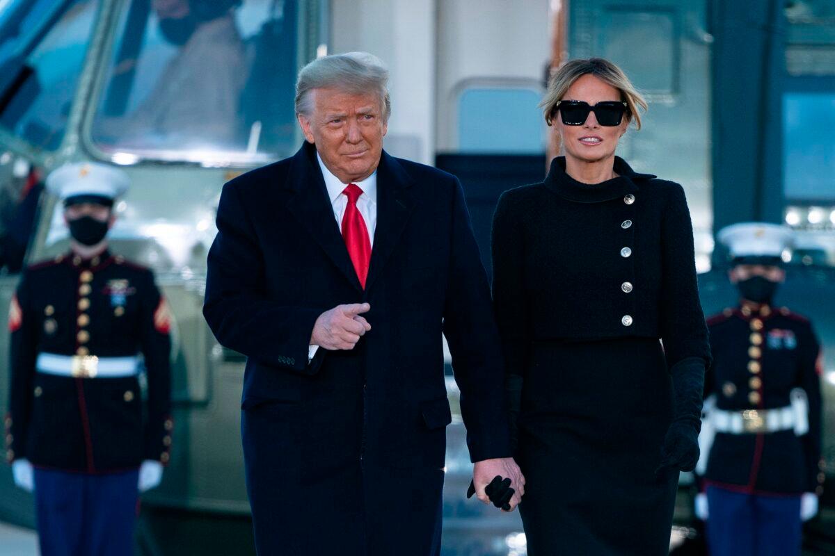 Then-President Donald Trump and First Lady Melania Trump step out of Marine One at Joint Base Andrews in Maryland on Jan. 20, 2021. (Alex Edelman/AFP via Getty Images)