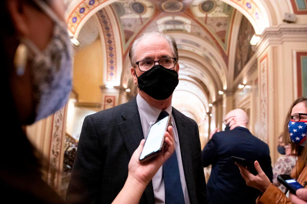 Sen. Mike Braun (R-Ind.) speaks to reporters at the U.S. Capitol in Washington on Feb. 11, 2021. (Michael Reynolds/Pool/AFP via Getty Images)