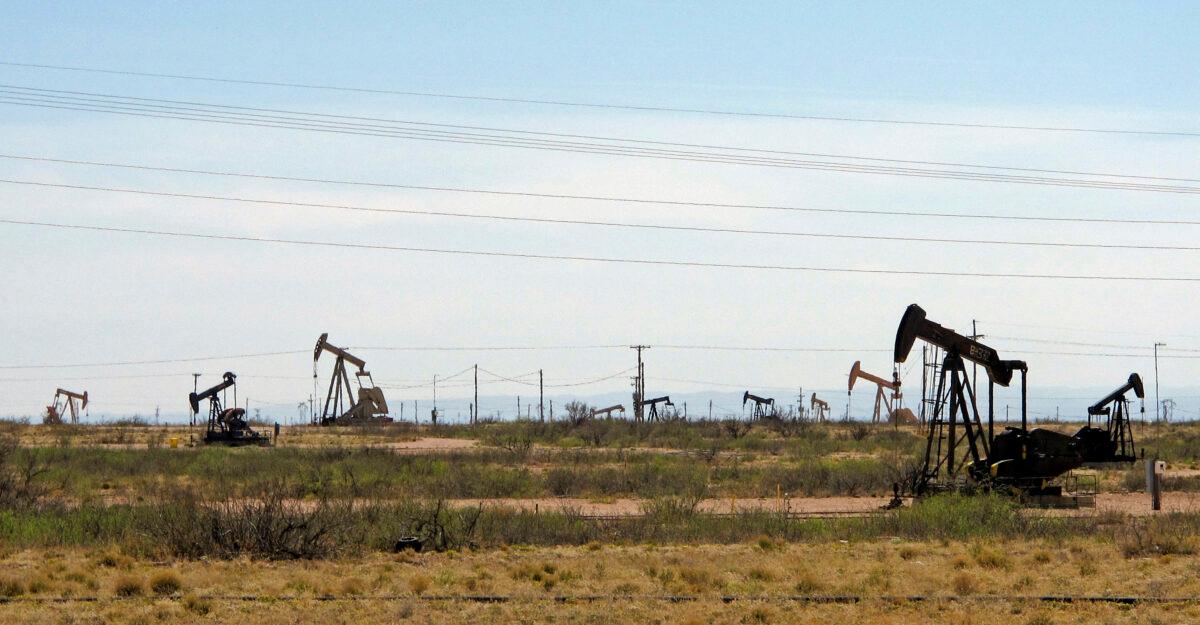 Oil rigs stand in the Loco Hills field on U.S. Highway 82 in Eddy County near Artesia, N.M., on April 9, 2014. (Jeri Clausing/AP Photo)