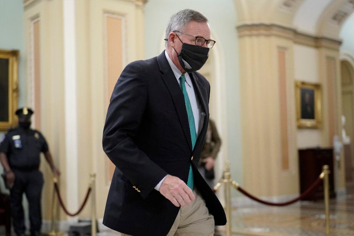 Sen. Richard Burr (R-N.C.) walks in the Capitol as the Senate proceeds in a rare weekend session for final arguments in the second impeachment trial of former President Donald Trump, at the Capitol in Washington on Feb. 13, 2021. (J. Scott Applewhite/AP Photo)