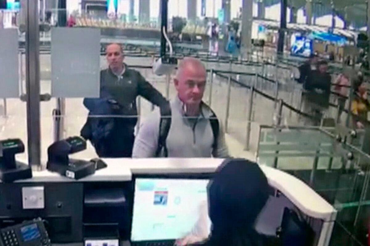Security camera video shows Michael L. Taylor, center, and George-Antoine Zayek at passport control at Istanbul Airport in Turkey on Dec. 30, 2019. (DHA via AP, File)