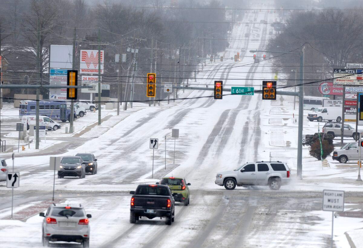 Snow covered city streets including at 61st and Sheridan in Tulsa, Okla., on Feb. 14, 2021. (John Clanton/Tulsa World via AP)