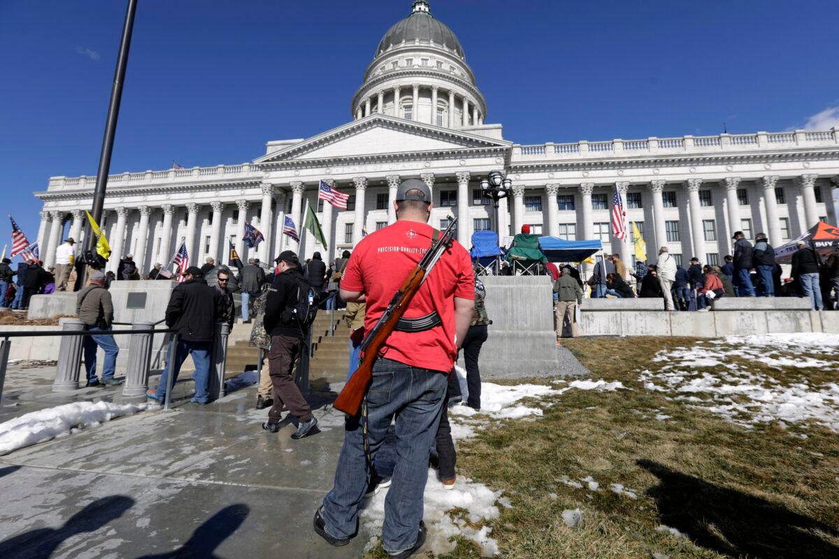 A man carries his weapon during a pro-Second Amendment rally at the Utah State Capitol in Salt Lake City, Utah, on Feb. 8, 2020. (Rick Bowmer/AP Photo)