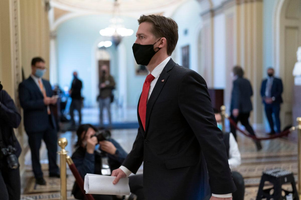 Sen. Ben Sasse (R-Neb.) leaves the chamber as the Senate voted to consider hearing from witnesses in the impeachment trial of former President Donald Trump, at the U.S. Capitol in Washington on Feb. 13, 2021. (J. Scott Applewhite/AP Photo)