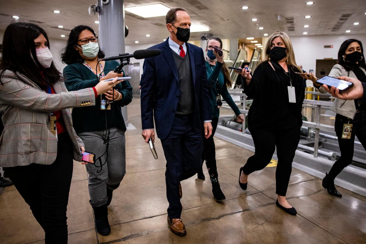 Senator Pat Toomey (R-Pa.) walks through the Senate subway at the conclusion of former President Donald Trump's second impeachment trial, in Washington on Feb. 13, 2021. (Samuel Corum/Getty Images)