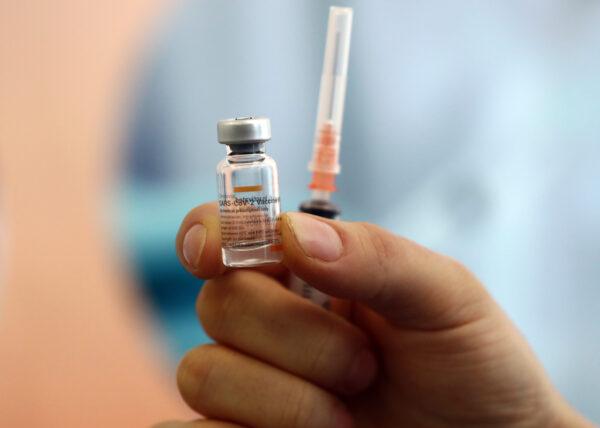A health worker shows a dose of CoronaVac vaccine during a COVID-19 vaccination campaign in Ankara, Turkey on Jan. 27, 2021. (ADEM ALTAN/AFP via Getty Images)