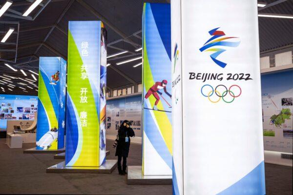 A journalist takes pictures of a display at the exhibition center for the Beijing 2022 Winter Olympics in Yaqing district in Beijing on Feb. 5, 2021. (Kevin Frayer/Getty Images)