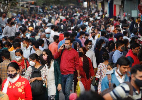 People walk in a market to shop ahead of the Diwali festival in New Delhi, India, on Nov. 12, 2020. (Manish Swarup/AP Photo)