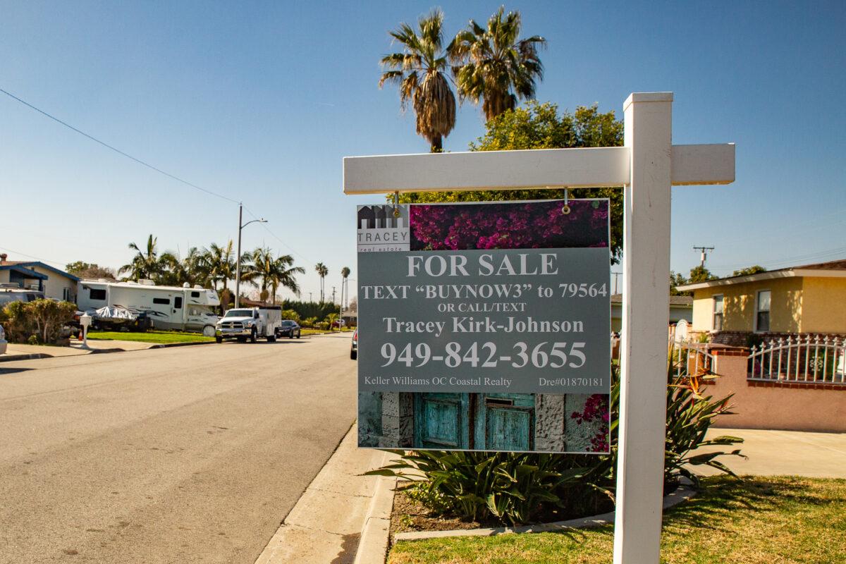A for-sale sign stands in front of a house in Garden Grove, Calif., on Feb. 7, 2020. (John Fredricks/The Epoch Times)